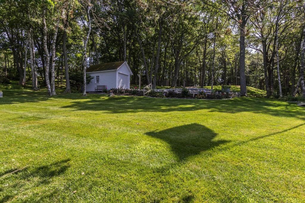 13 Spruce Shores Road East Boothbay, ME 04544 - Photo 31 of 35 Large back lawn and storage garage.