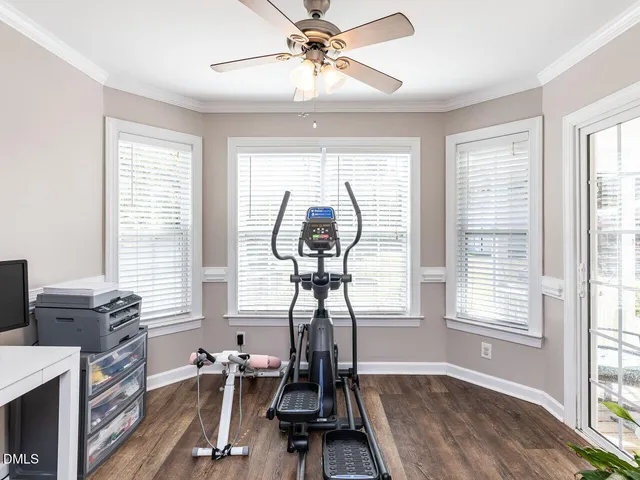 a room with gym equipment and a window