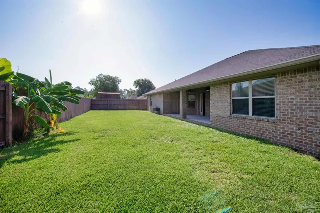a backyard of a house with seating space