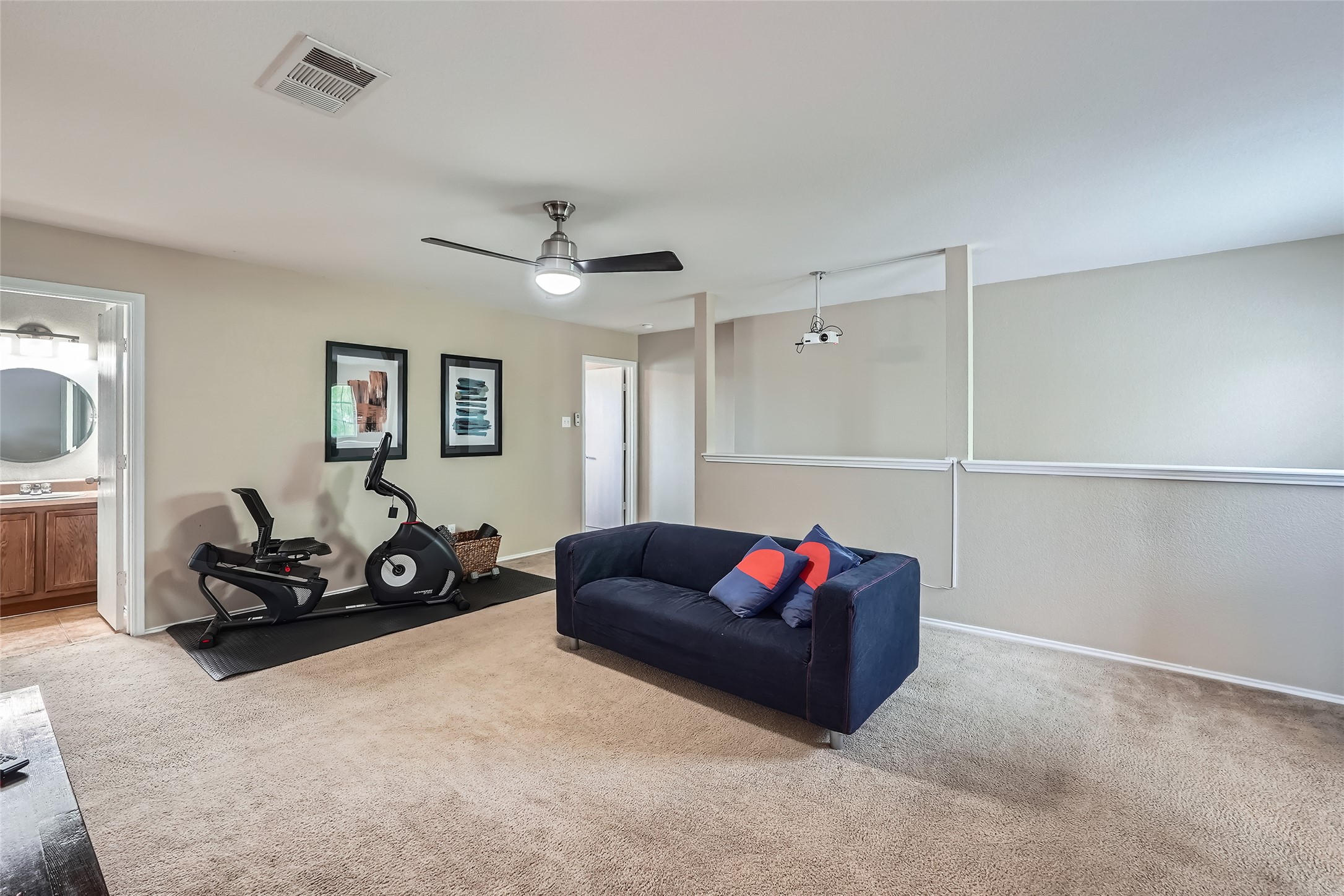 18021 Prairie Verbena Lane Elgin, TX 78621 - Photo 25 of 33 A well-lit bonus room provides versatile space for recreation and fitness equipment.