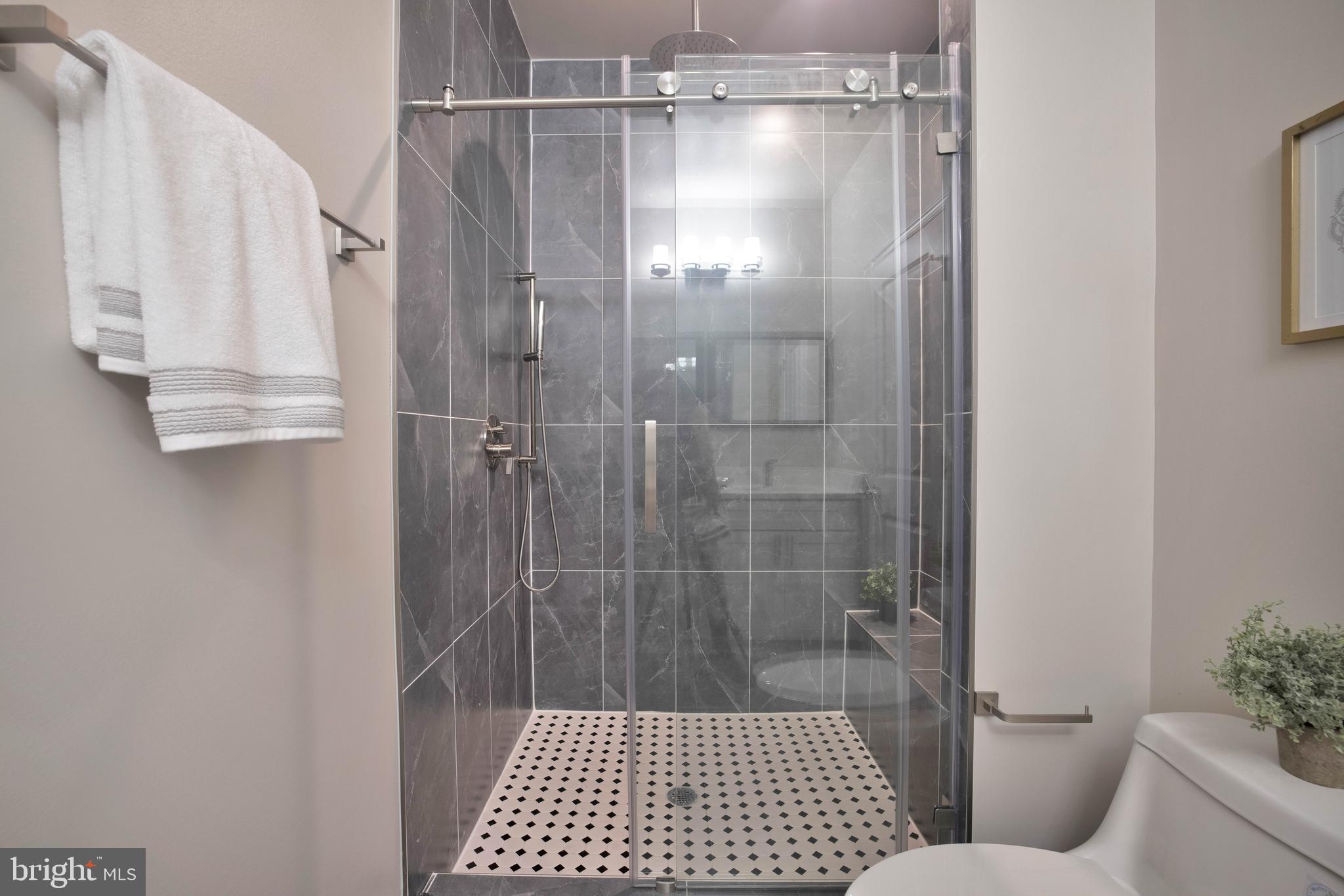 2415 Elvans Road Southeast Washington, DC 20020 - Photo 35 of 47 Walk in shower w/ luxury tile