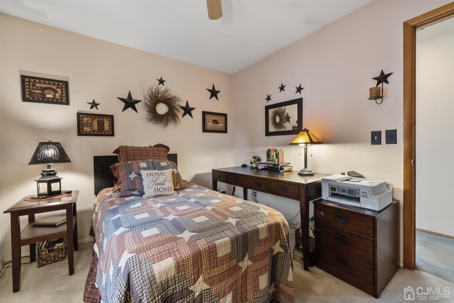 78 Highfield Road Colonia, NJ 07067 - Photo 4 of 8 a bedroom with a bed and a desk