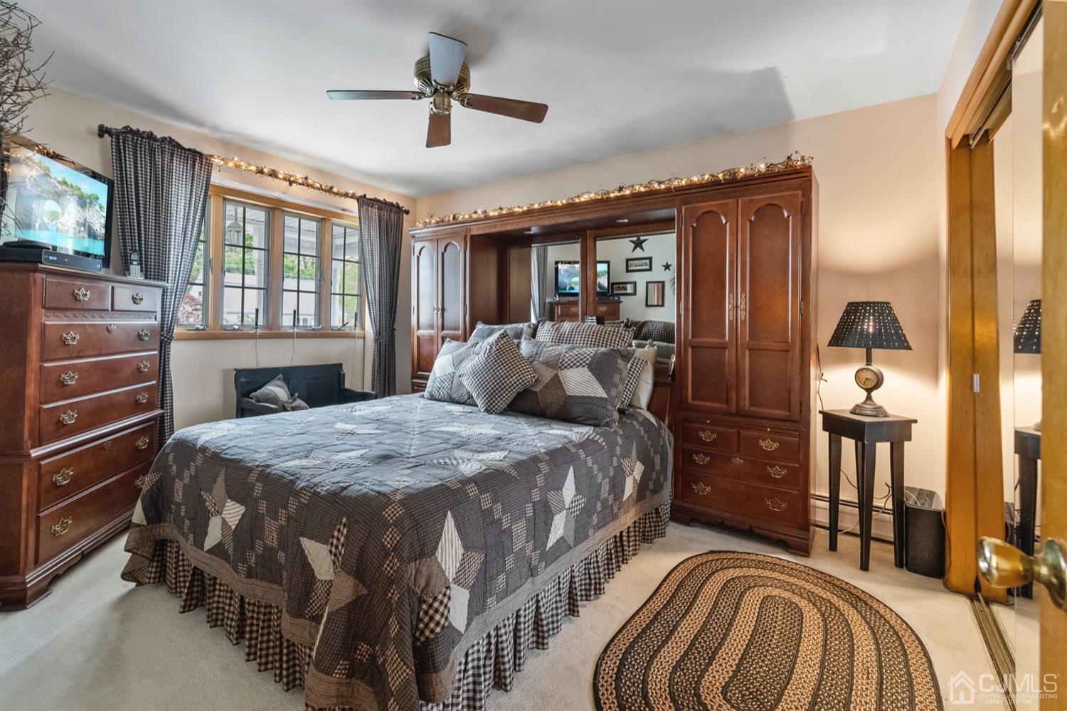 78 Highfield Road Colonia, NJ 07067 - Photo 5 of 8 a bed sitting in a bedroom next to a window