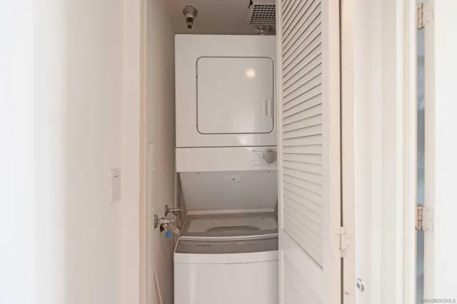 a close view of a utility room with washer and dryer