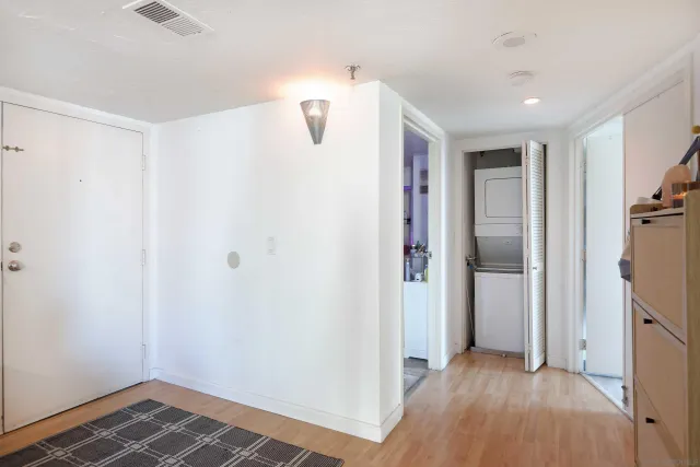 a view of hallway with wooden floor