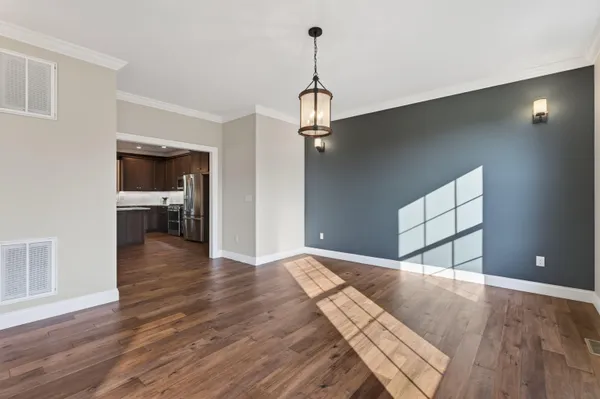 a view of an empty room with wooden walls