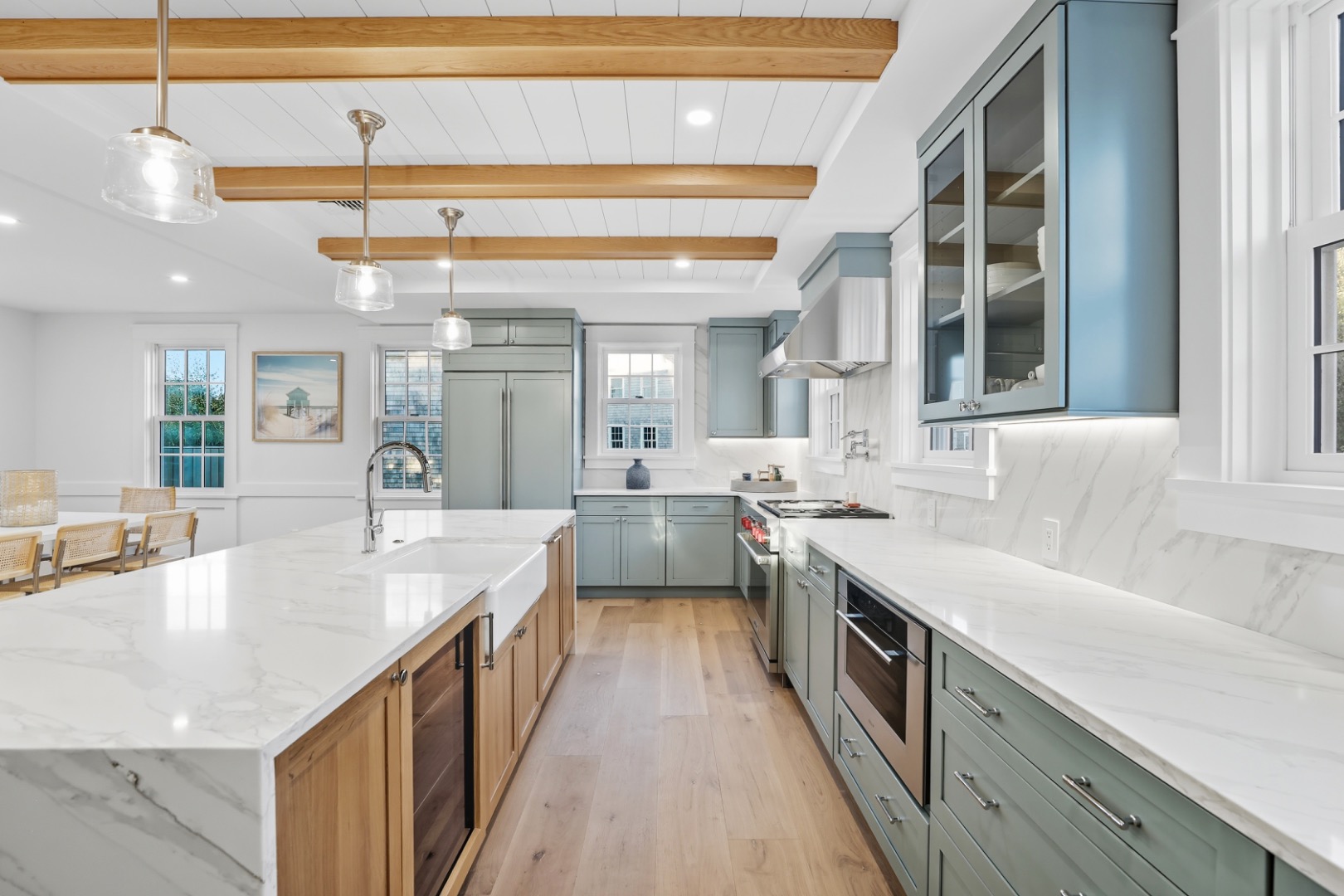 2 Mariner Way Nantucket, MA 02554 - Photo 5 of 34 a large kitchen with a large counter top a sink a window and stainless steel appliances