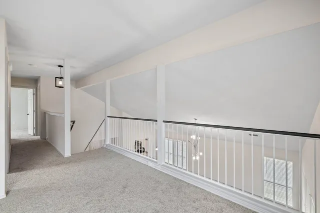 a view of a hallway with staircase