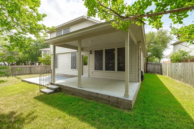 a view of backyard with a swimming pool