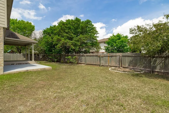 a swimming pool with wooden fence
