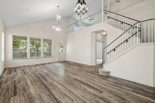 a view of an entryway with wooden floor
