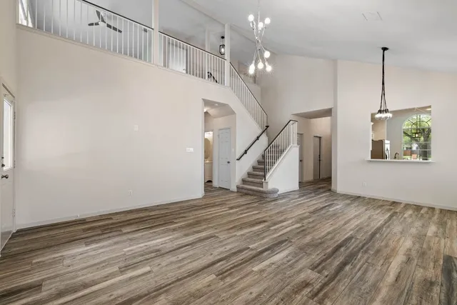 a view of an entryway with wooden floor
