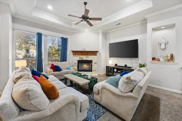 a kitchen with stainless steel appliances granite countertop a refrigerator a stove and a sink