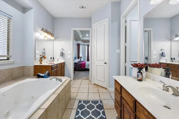 a bathroom with a bathtub and a sink