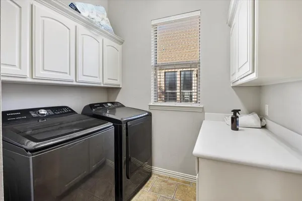 a kitchen that has a sink and a stove