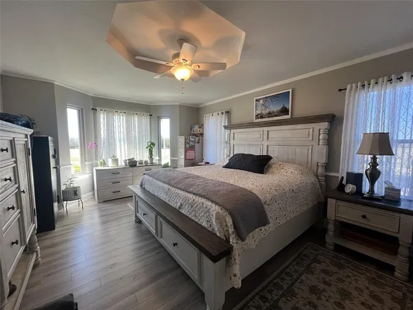 a bedroom with bed and window