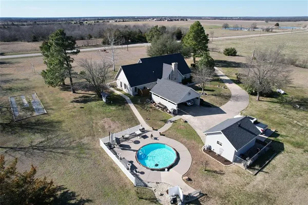 an aerial view of a house with garden space and sitting space