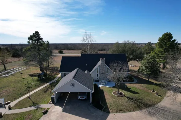an aerial view of a house with swimming pool