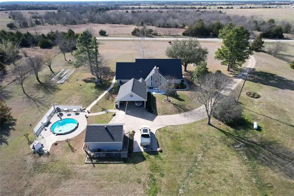 an aerial view of a house with garden