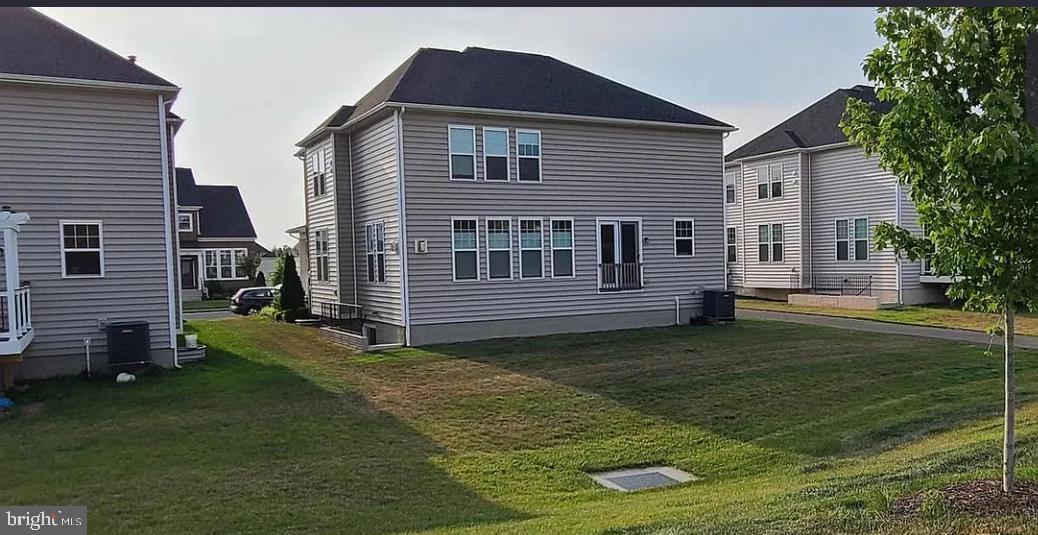 24800 Beardgrass Place Aldie, VA 20105 - Photo 12 of 25 a view of a house with a backyard