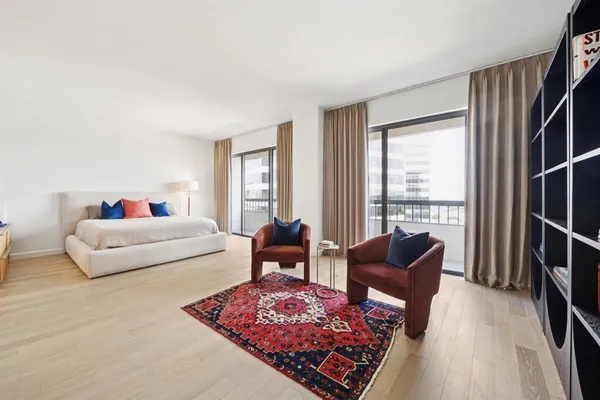 a living room with furniture and a rug