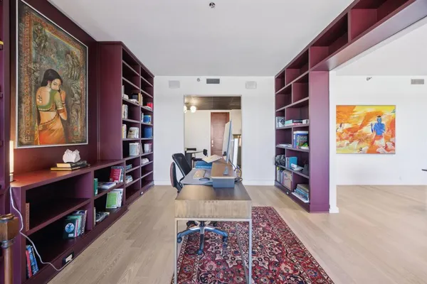 a living room with furniture and a rug
