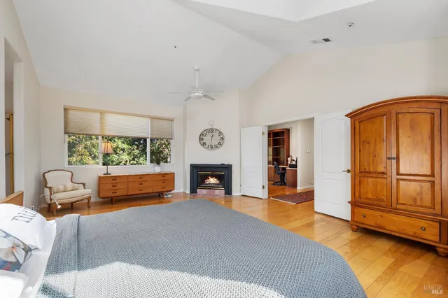 a bedroom with furniture and a fireplace
