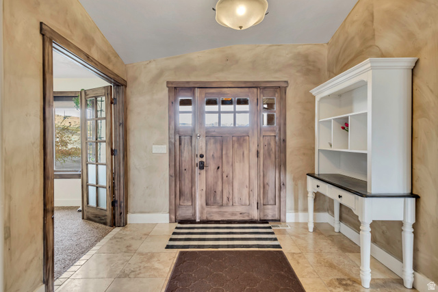 3054 West Ridgeline Road Stockton, UT 84071 - Photo 29 of 88 Foyer featuring vaulted ceiling and healthy amount of natural light