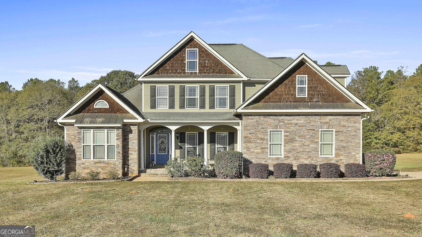 a front view of a house with a yard