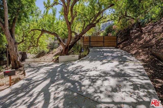 a backyard of a house with lots of green space