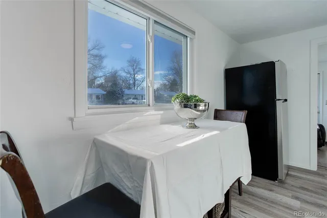 a dining room with a table and chairs