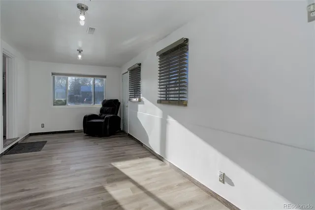 a view of a livingroom with furniture and window