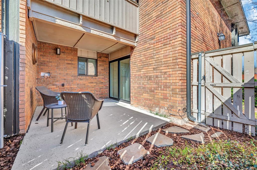 2809 Rio Branco Street, Unit 102 Farmers Branch, TX 75234 - Photo 20 of 21 a patio with table and chairs