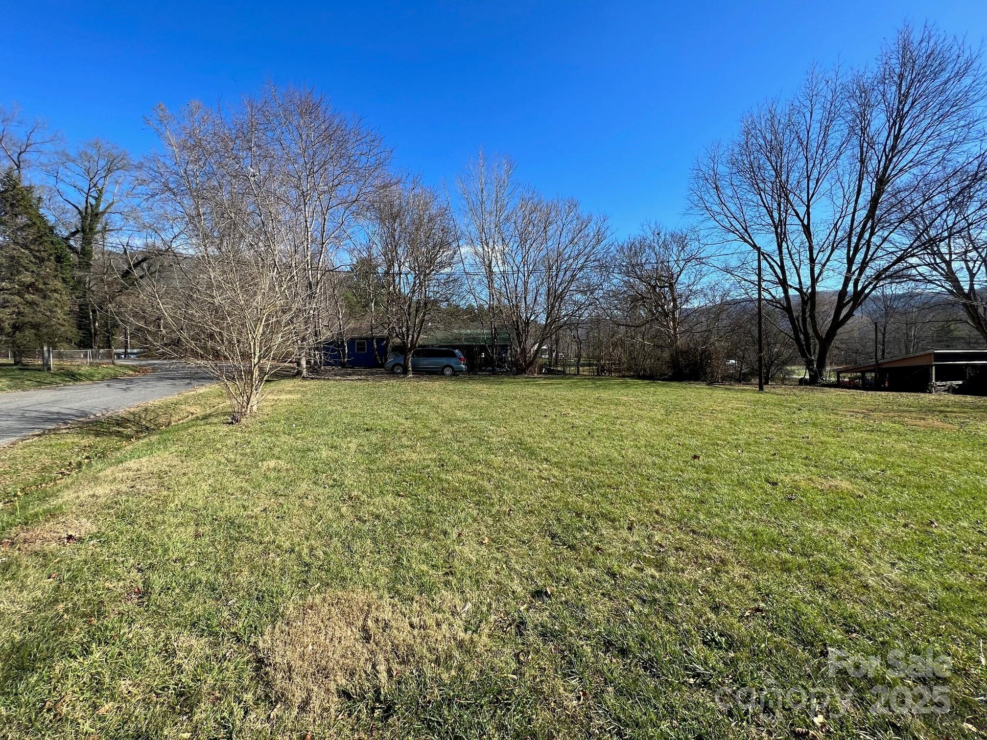 9 Riddle Road Swannanoa, NC 28778 - Photo 14 of 21 a view of a yard with a house in the background