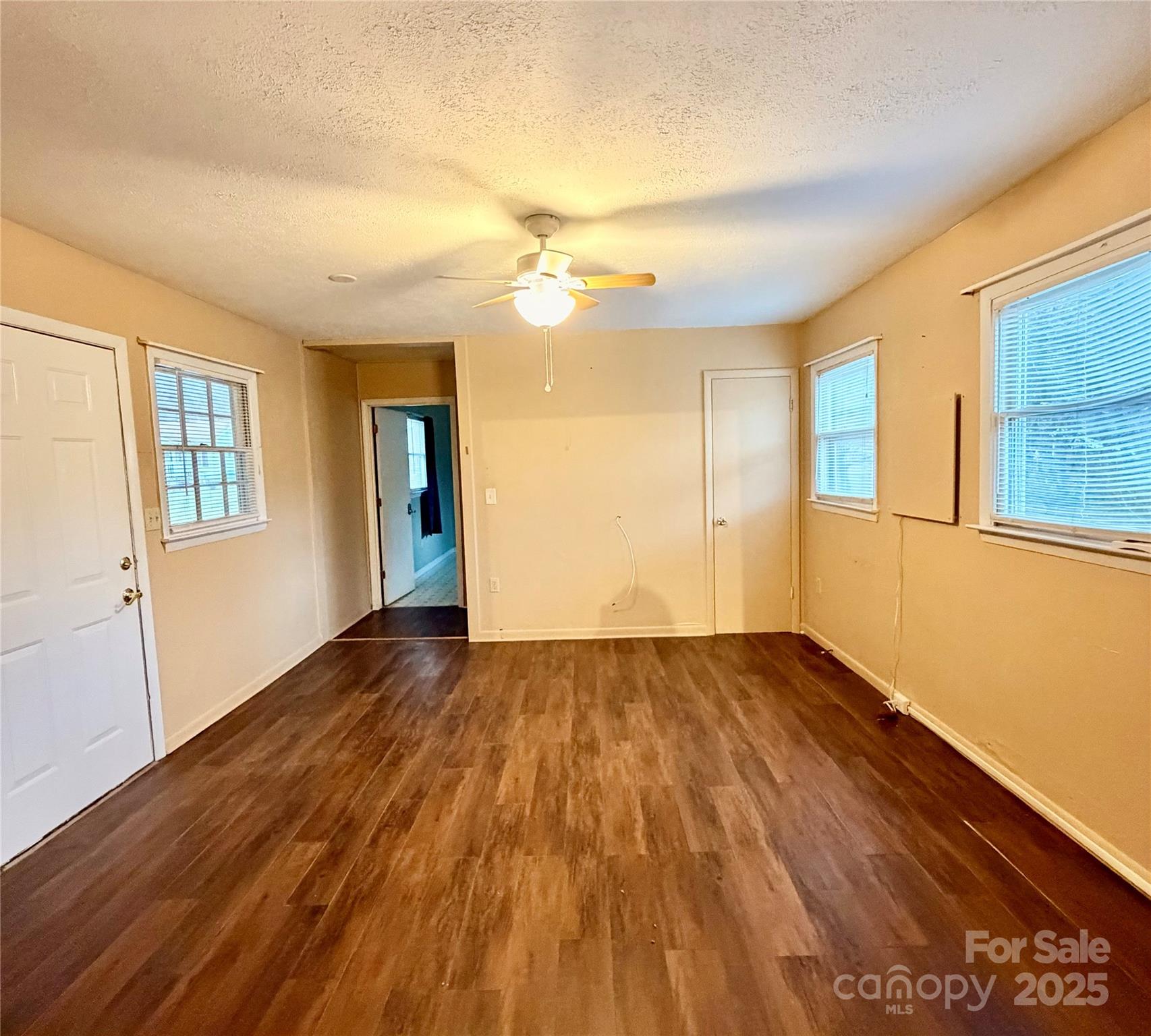 9 Riddle Road Swannanoa, NC 28778 - Photo 4 of 21 wooden floor in an empty room with a window