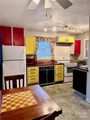 a view of kitchen with furniture and a fireplace