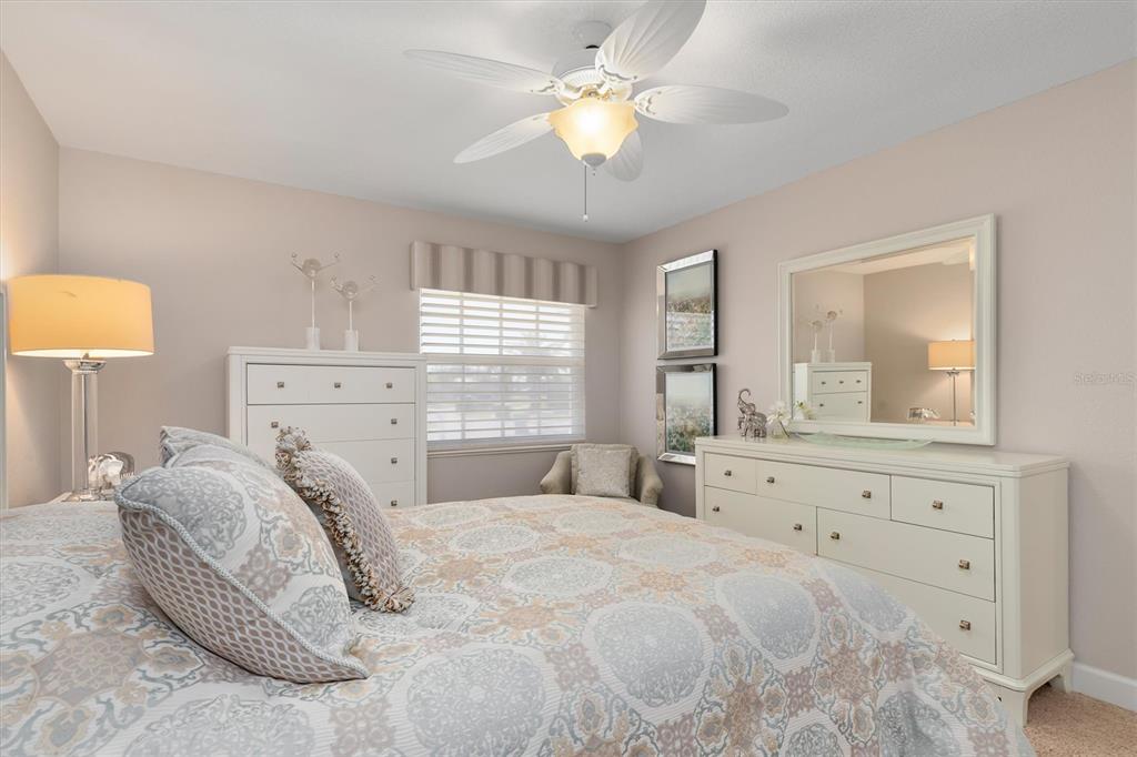 374 Severin Road Southeast Port Charlotte, FL 33952 - Photo 33 of 67 a bedroom with a bed and a dresser