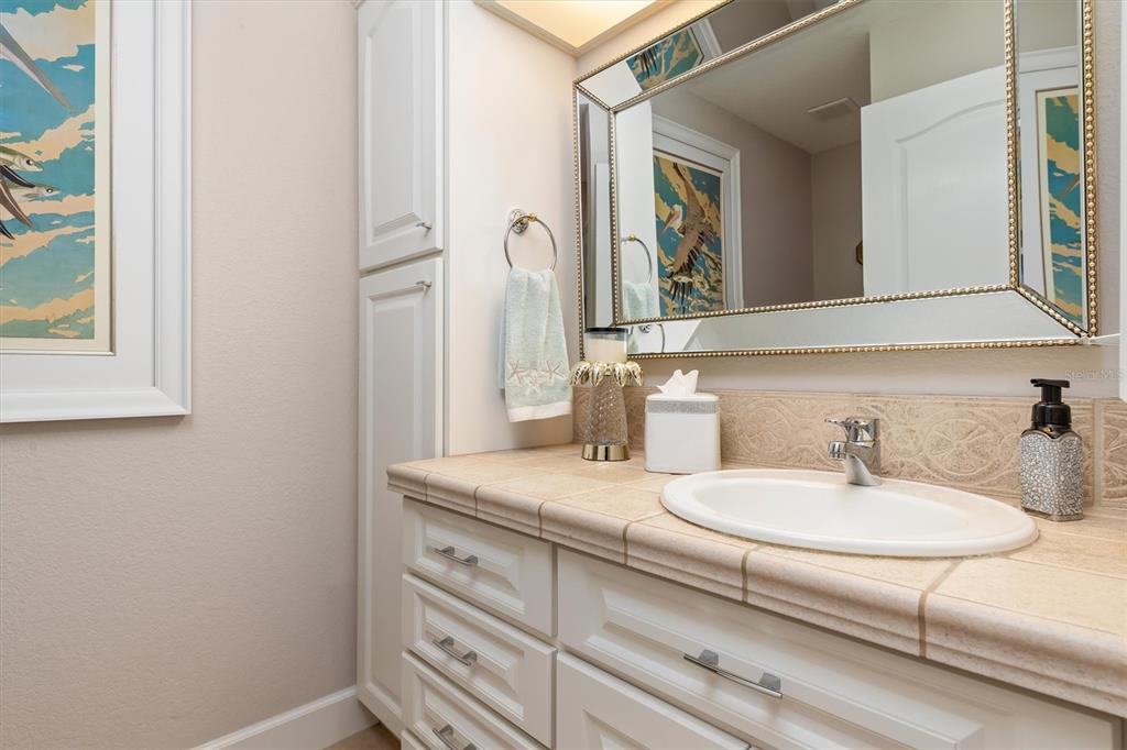 374 Severin Road Southeast Port Charlotte, FL 33952 - Photo 34 of 67 a bathroom with a sink and a mirror
