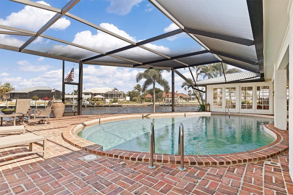 374 Severin Road Southeast Port Charlotte, FL 33952 - Photo 40 of 67 a view of a swimming pool with a patio