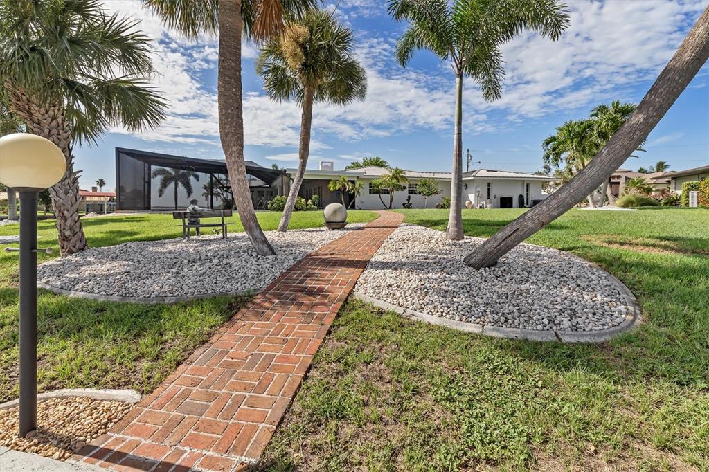 374 Severin Road Southeast Port Charlotte, FL 33952 - Photo 53 of 67 a front view of a house with garden