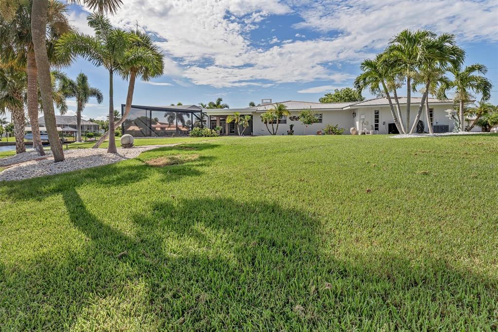 374 Severin Road Southeast Port Charlotte, FL 33952 - Photo 55 of 67 a view of house with garden and trees