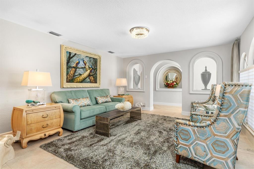 374 Severin Road Southeast Port Charlotte, FL 33952 - Photo 9 of 67 a living room with furniture and a window