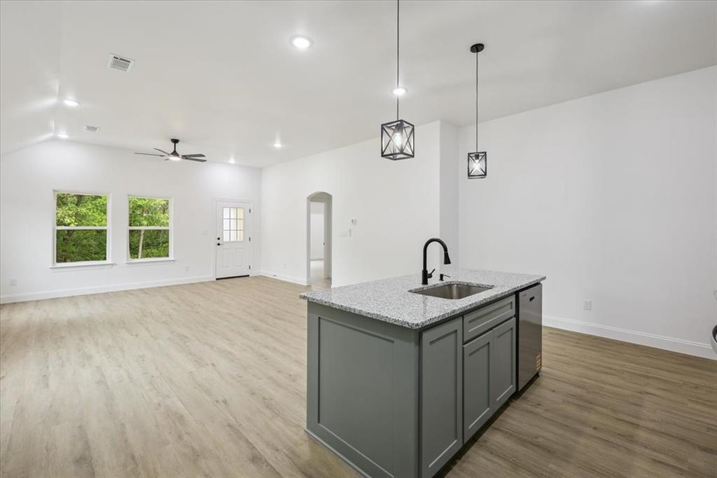 111 North Oak Street Ector, TX 75439 - Photo 19 of 34 a kitchen with a sink and window