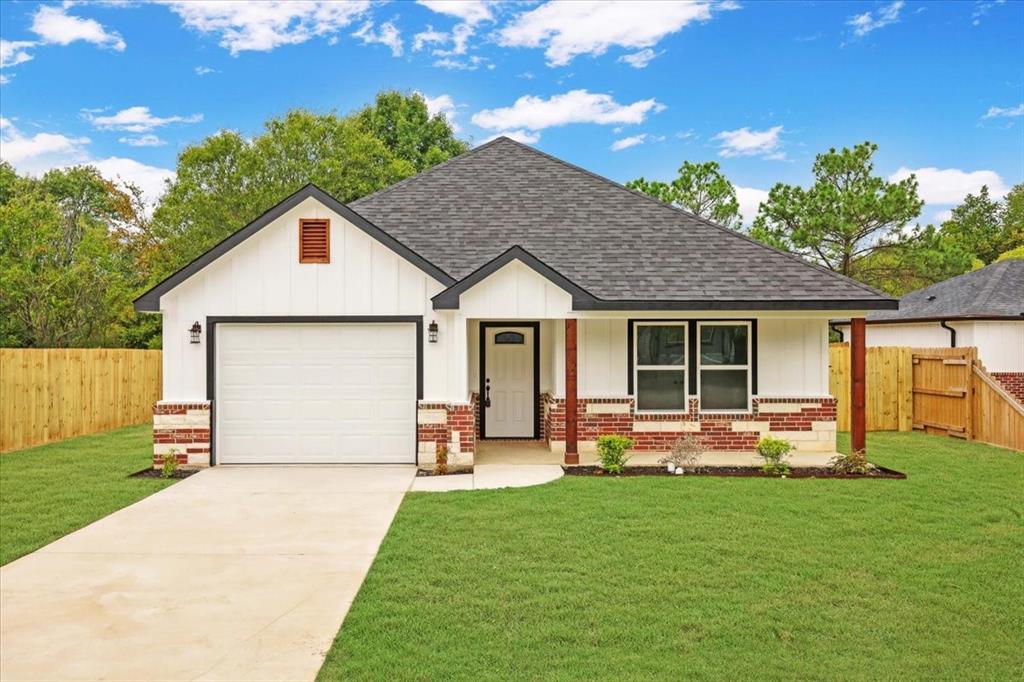 111 North Oak Street Ector, TX 75439 - Photo 2 of 34 a front view of house with yard outdoor seating and green space