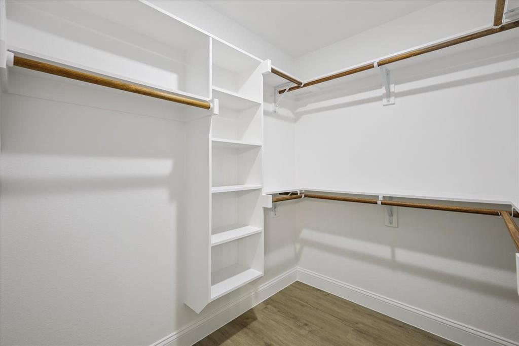 111 North Oak Street Ector, TX 75439 - Photo 27 of 34 a view of walk in closet with empty racks