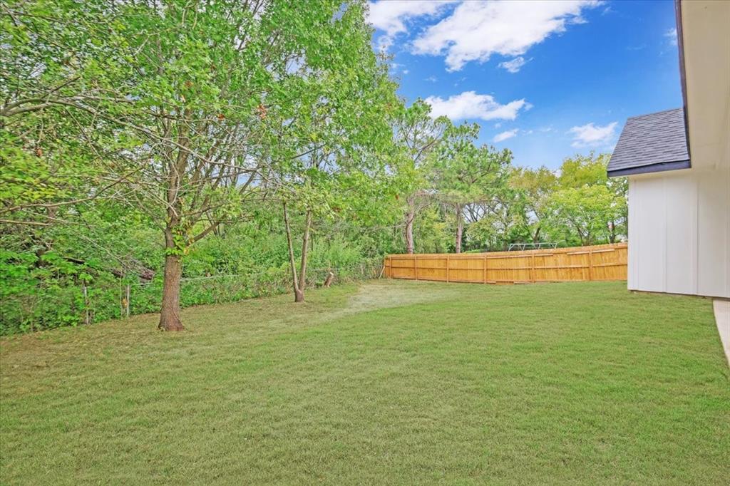 111 North Oak Street Ector, TX 75439 - Photo 32 of 34 a view of yard with tree