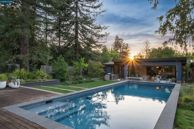 a view of swimming pool with a yard