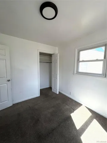 en empty room with windows