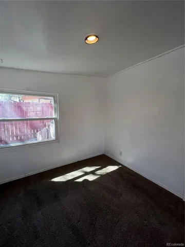 a view of an empty room and window