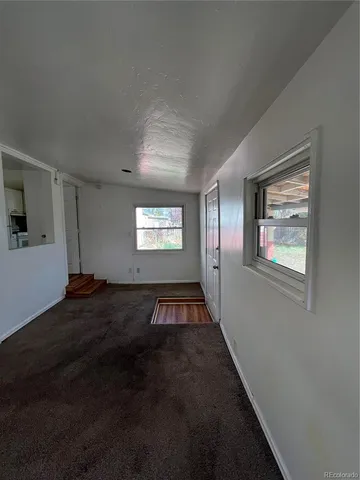 a view of an empty room and window
